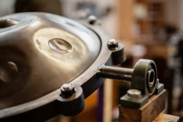 handpan on a construction tool in a musician workshop.