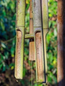 bamboo wind chimes hanging from roof in garde