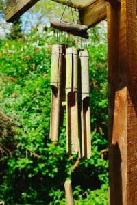 bamboo wind chimes hanging from roof in garde