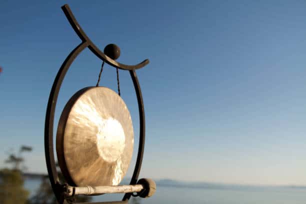 gong with vibrant blue sky background