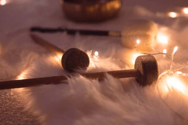 pair of sticks using in sound healing therapy, in festive ambient light