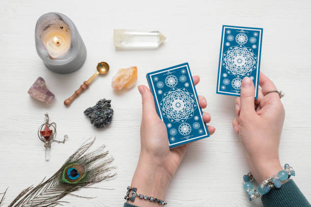 fortune teller is reading the future with a tarot cards top view.